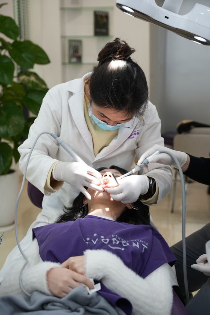 A dental procedure being conducted by a professional dentist in an office setting.