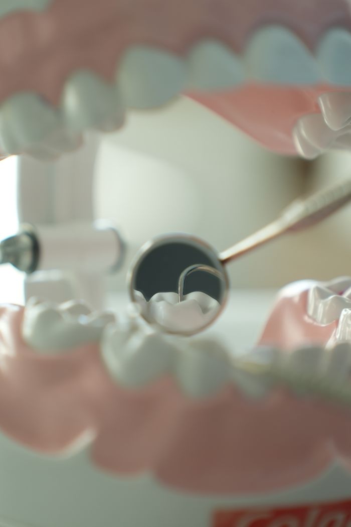 Crafting Captivating Headlines: Your awesome post title goes here Close-up view of dental tools and model teeth, used for dental education and practice.